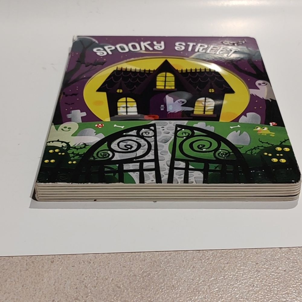 spooky fun children's board book titled "Spooky Street" Roger Priddy 2017